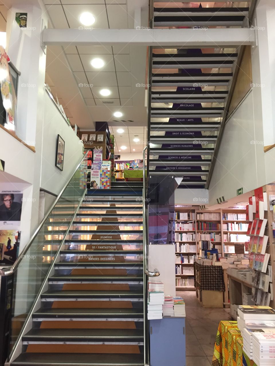 In front of the stairs in Kléber bookstore in Strasbourg France