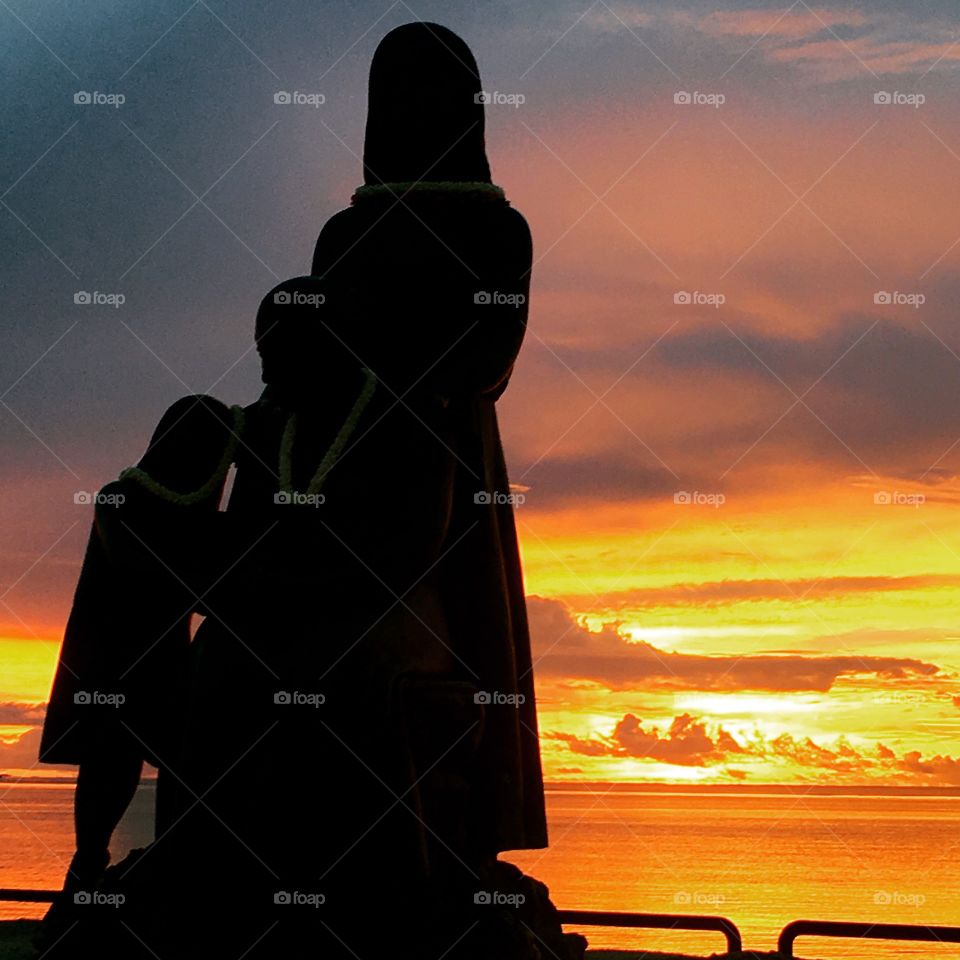 Statue sunset