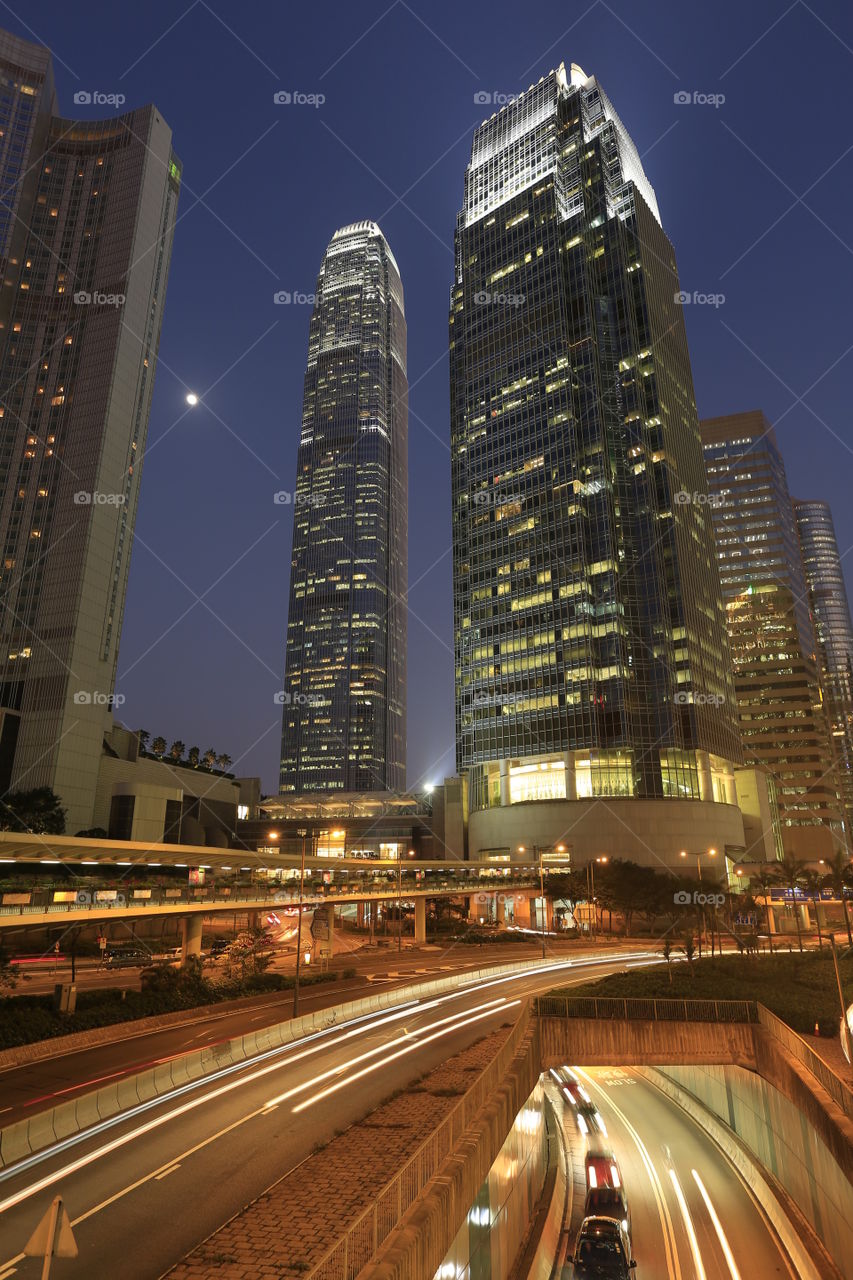 Hong Kong's IFCs. IFC and IFC Two buildings with the moon 