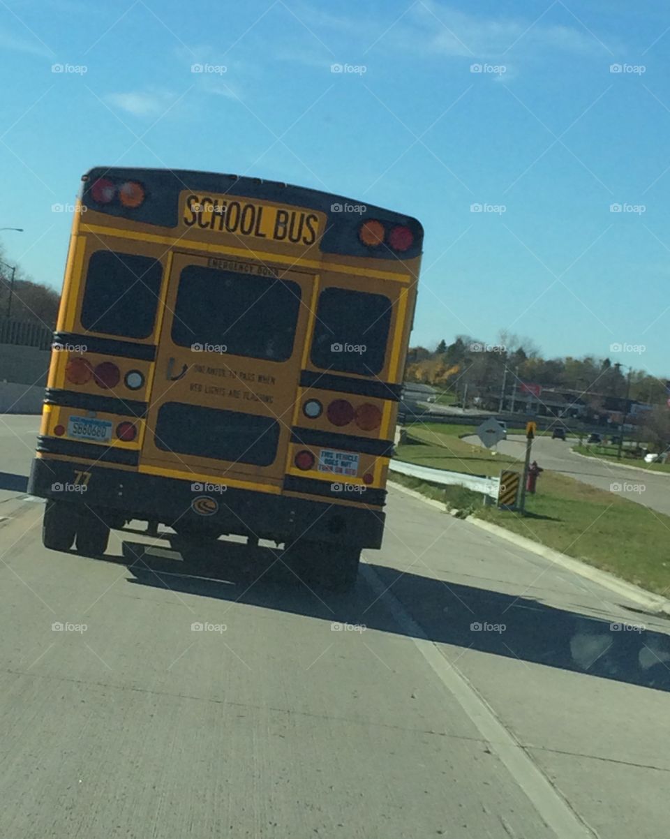 Yellow school bus on road 