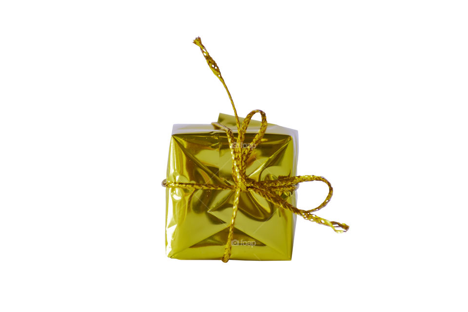 Isolated Gift box gold for the festivities on a white background with clipping path.