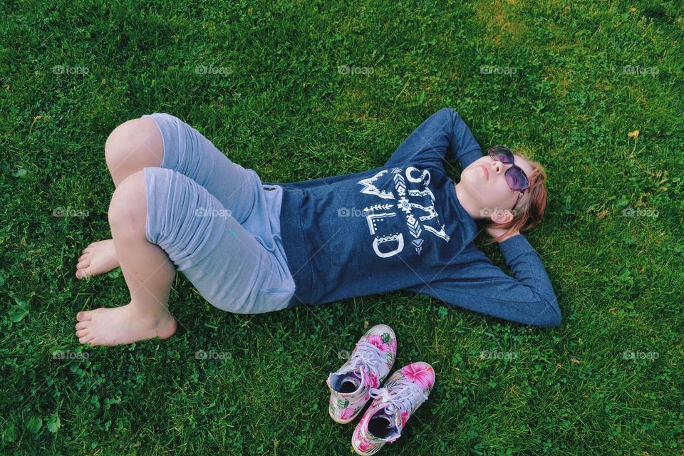 Girl laying in the grass