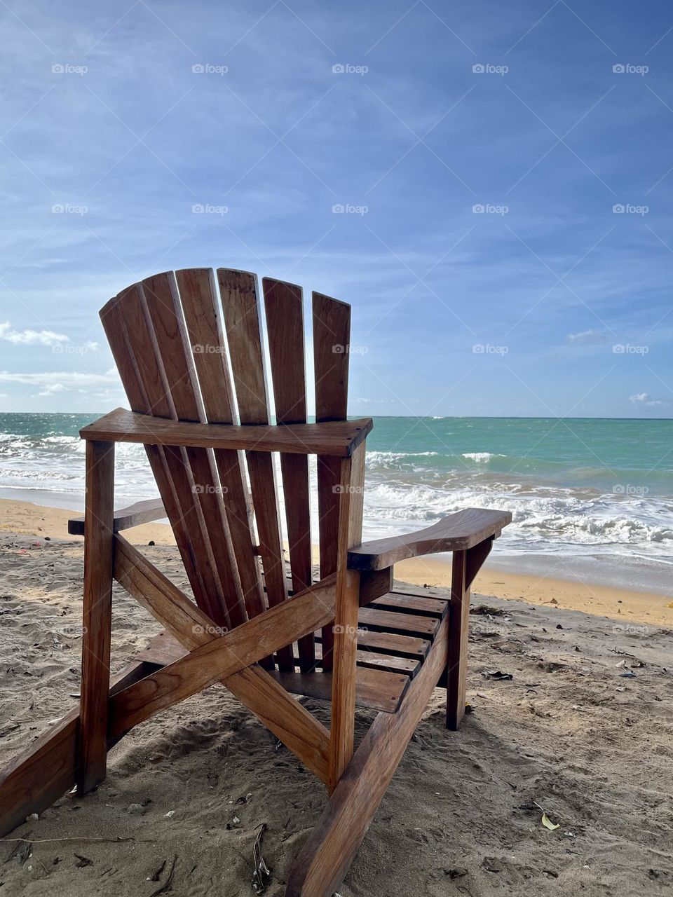 Wooden chair in the Sandy beach 