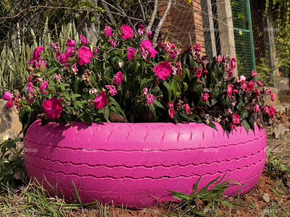 Barbie Pink World - Pink recycled tire planter.