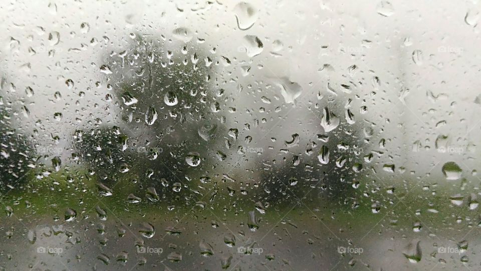 Rainy Drops On Window Of Car
