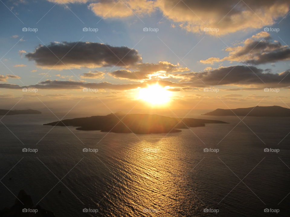Santorini sunset golden. Santorini sunset golden over caldera