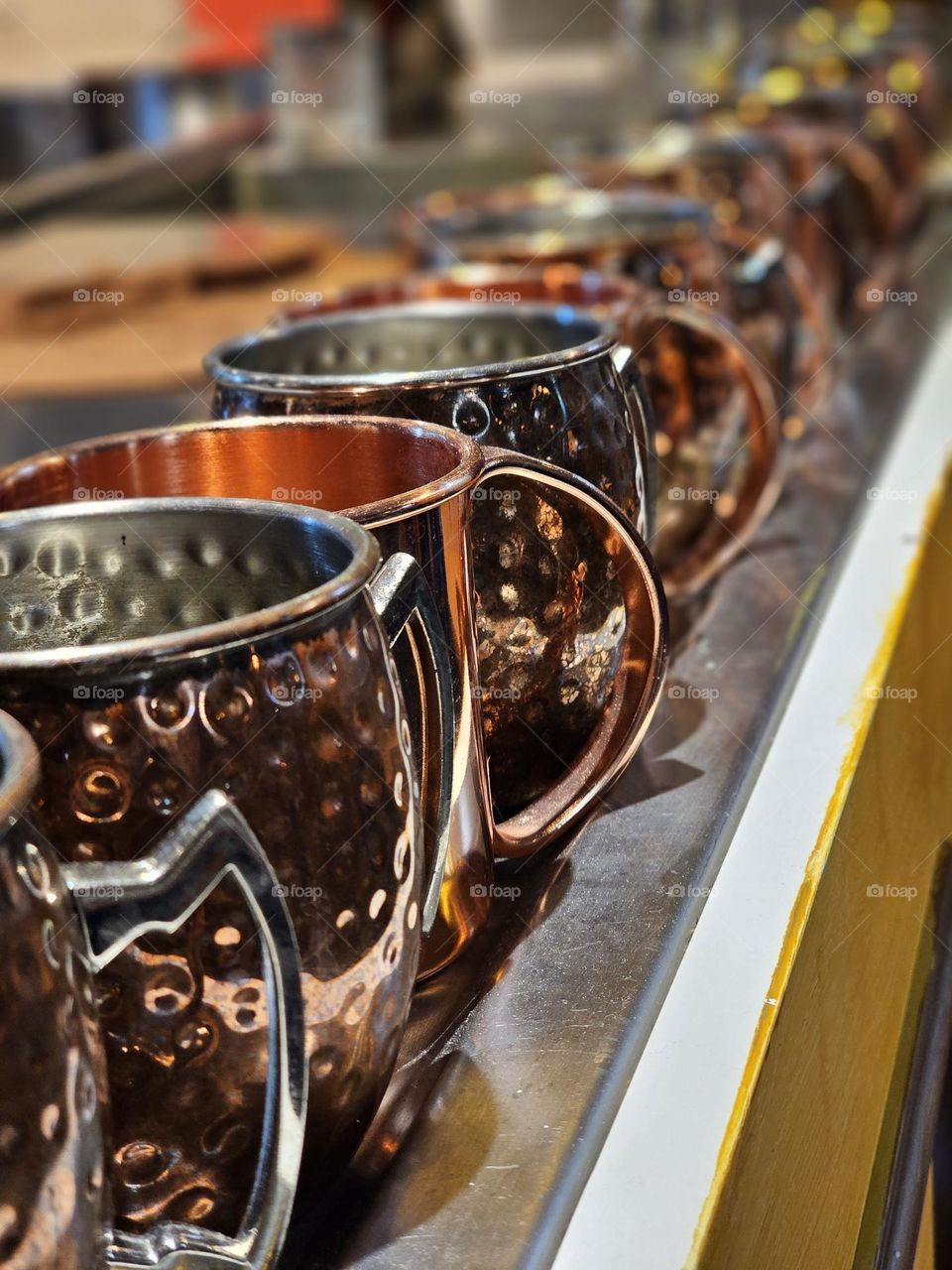 Copper cups standing in line