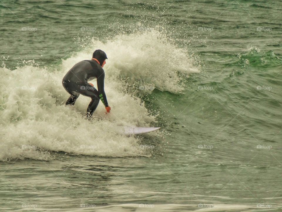 Riding the waves in Pacifica, California
