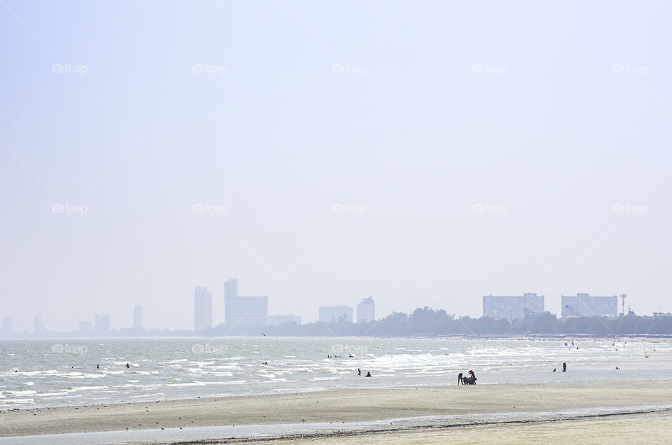 The tourists on the beach in the holidays at Cha am beach. Petchaburi in Thailand. March 24, 2019