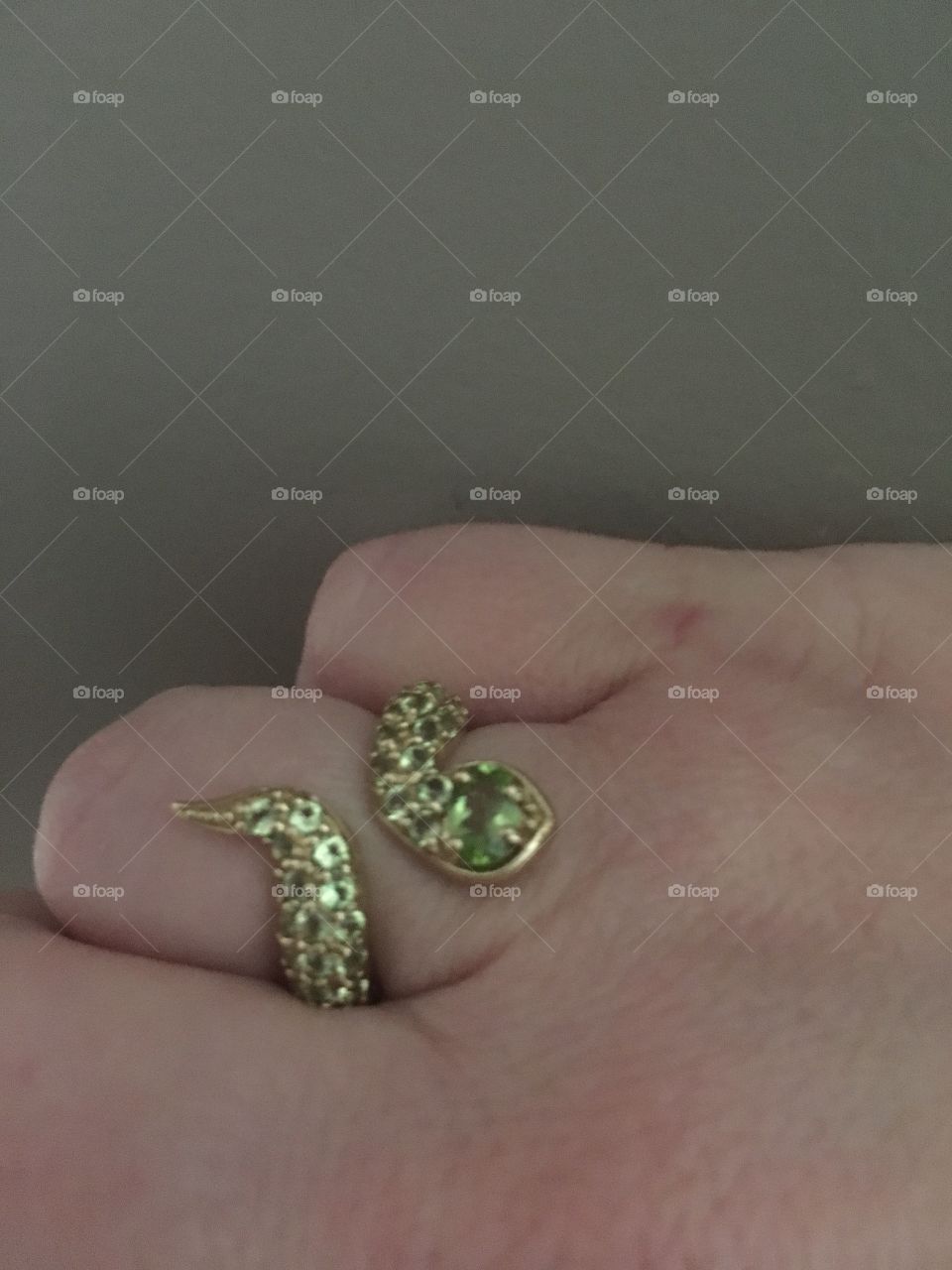 Snake ring with green gems 