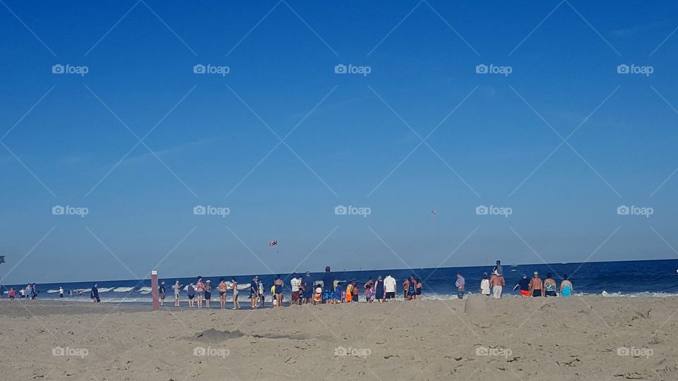 Crowd gathered on beach
