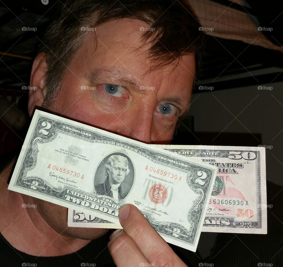 Man holding american dollars