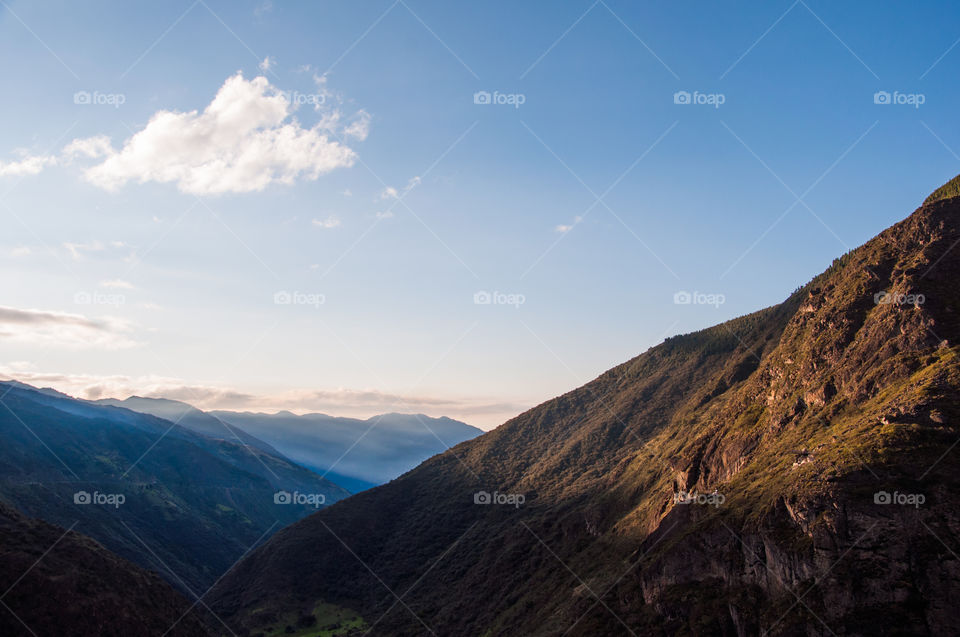 Mountain lit by daylight at sunrise 