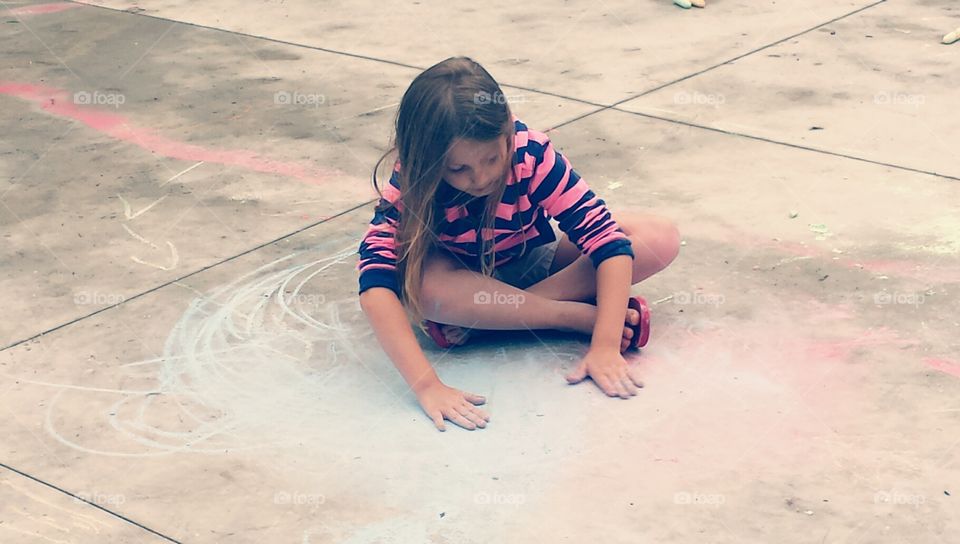 for the love of the process. young girl getting creative with chalk