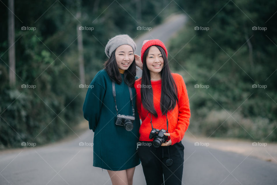 Asian girl smiling on the road