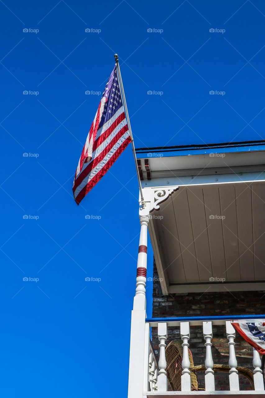 American flag flying high for July fourth celebrations in Jamestown California at the Jamestown hotel 