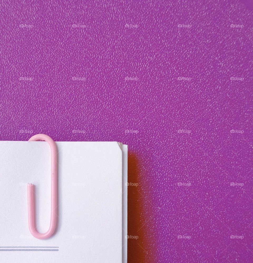 paper clip in the book with purple background...