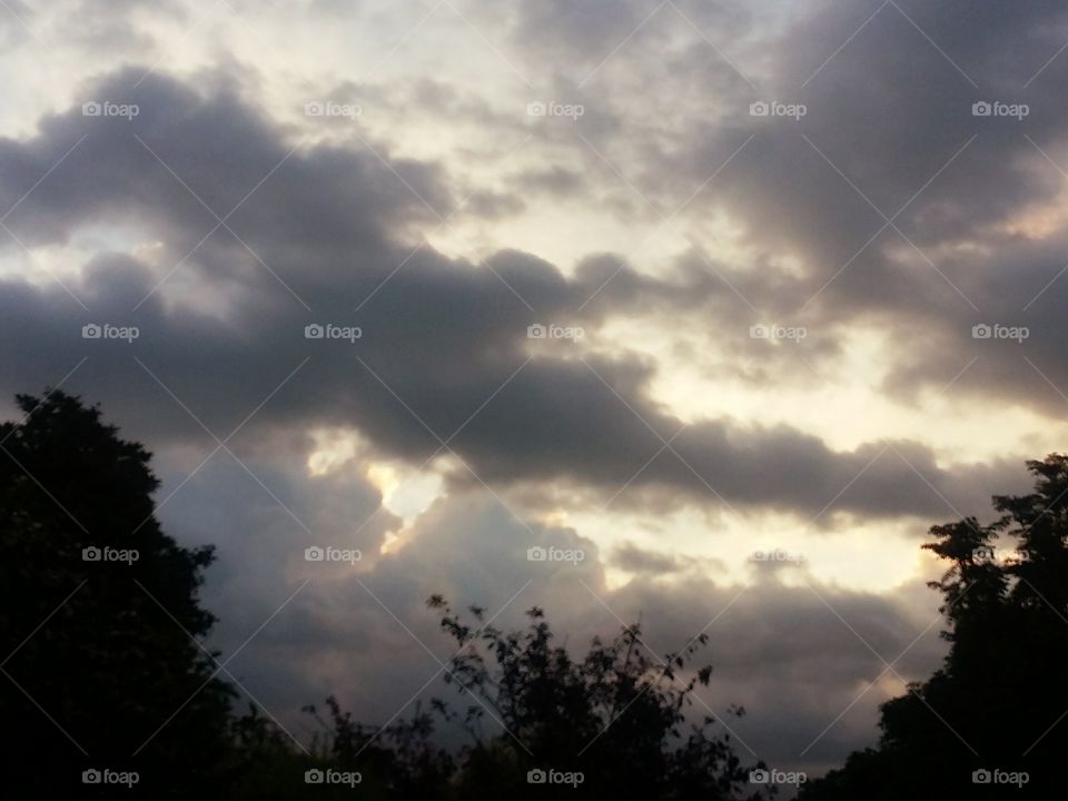 Sun behind the clouds