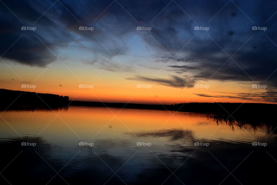Colorful sunset on the lake. Ural. Sverdlovsk region, Russia