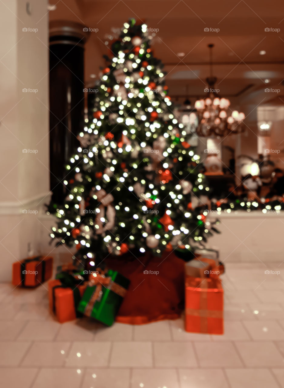 Christmas tree and lights, chandelier in background