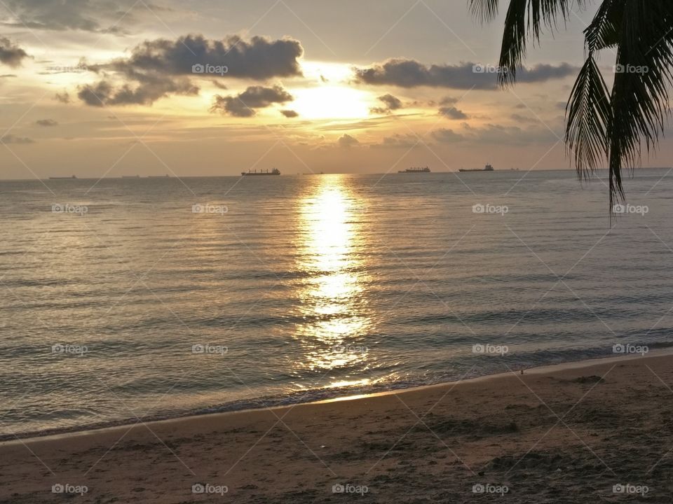 Golden sunset reflecting itself on the ocean.