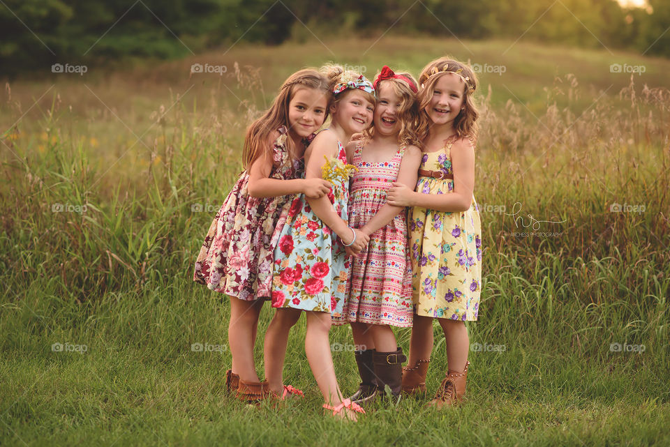Young friends in dresses