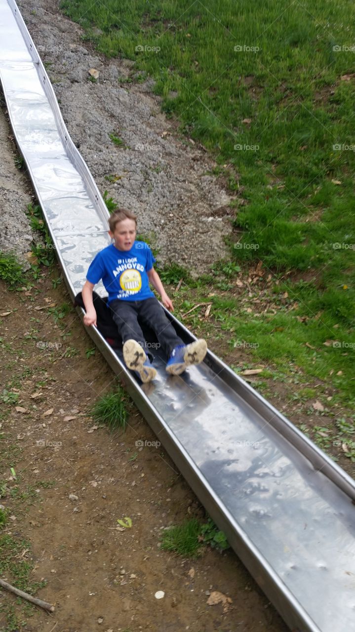 big brothers turn on the giant slide