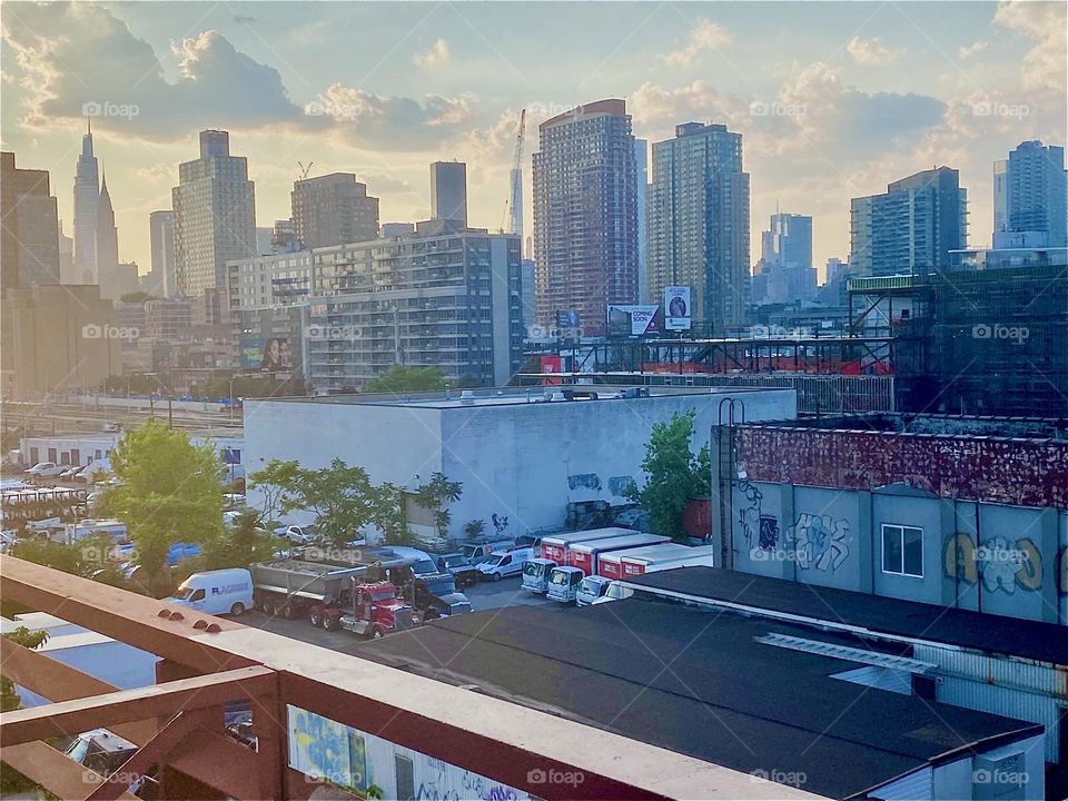 This is the view from “Long Island City”, Queens across the “East River” at “Newtown Creek” onto “Greenpoint“, Brooklyn during the golden hour of sunset. 2023. Hypnotic Productions
