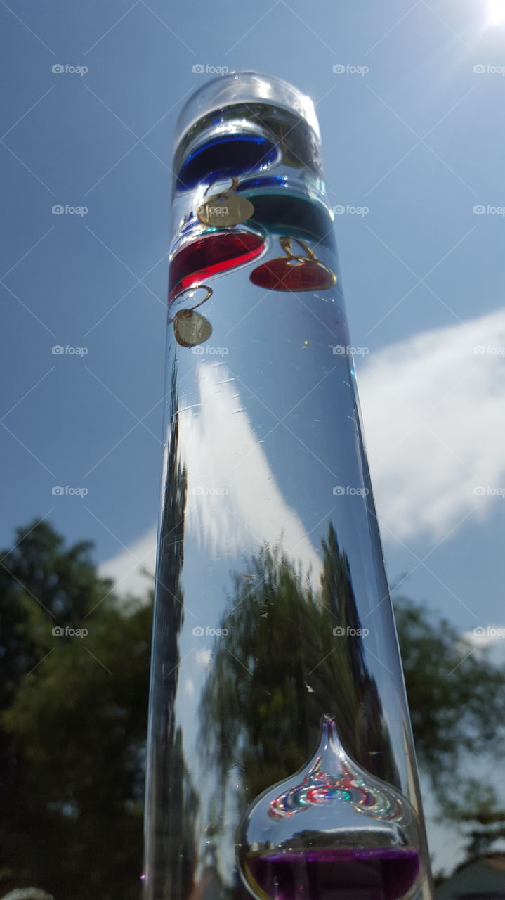 Galileo thermometer. close up of hand blown glass Galileo thermometer