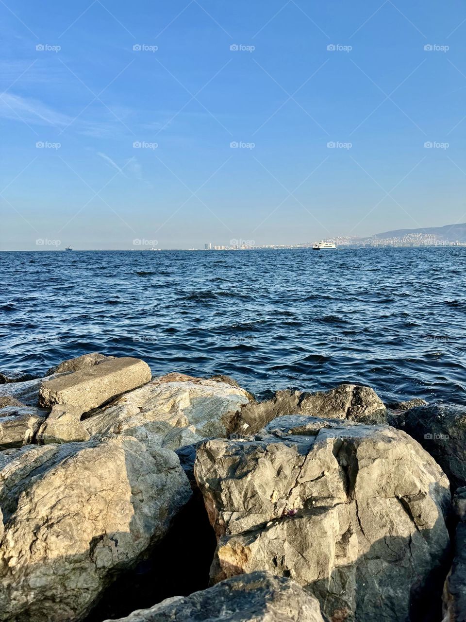 Sea water washing the rocks near the shore