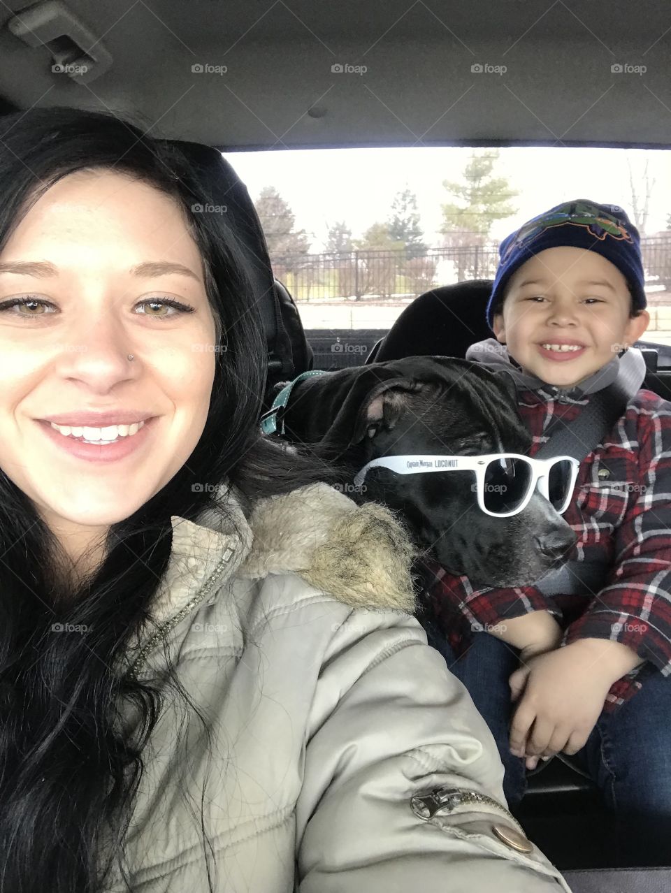 Me with my little brother and my pit bull baby, he put his glasses on her! She doesn’t mind at all!