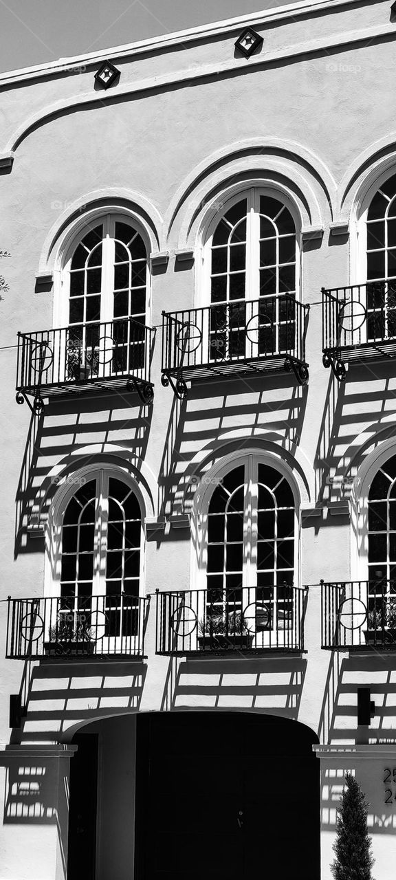 French style building in the marina district of San Francisco beautiful light and shadows on this classic style with its arched windows 