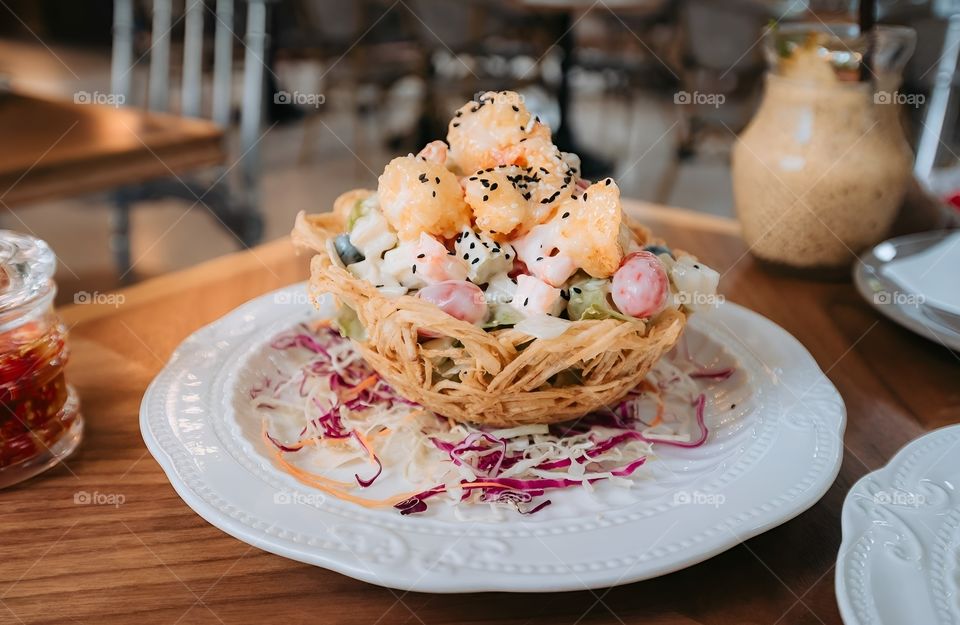 fried basket with fruit cream salad