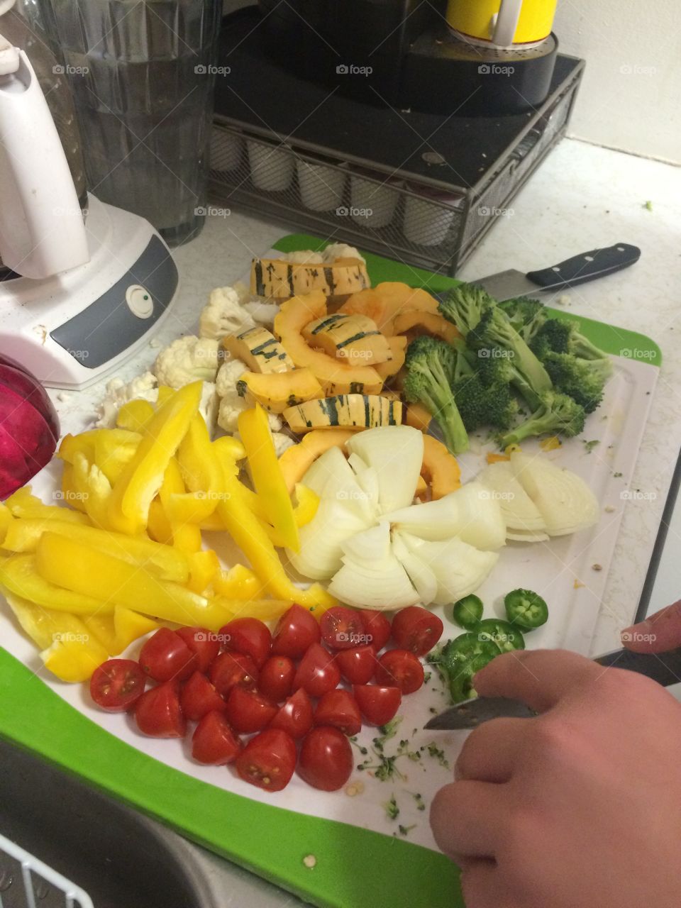 Vegetable Chopping. Meal preparation by chopping various vegetables to cook