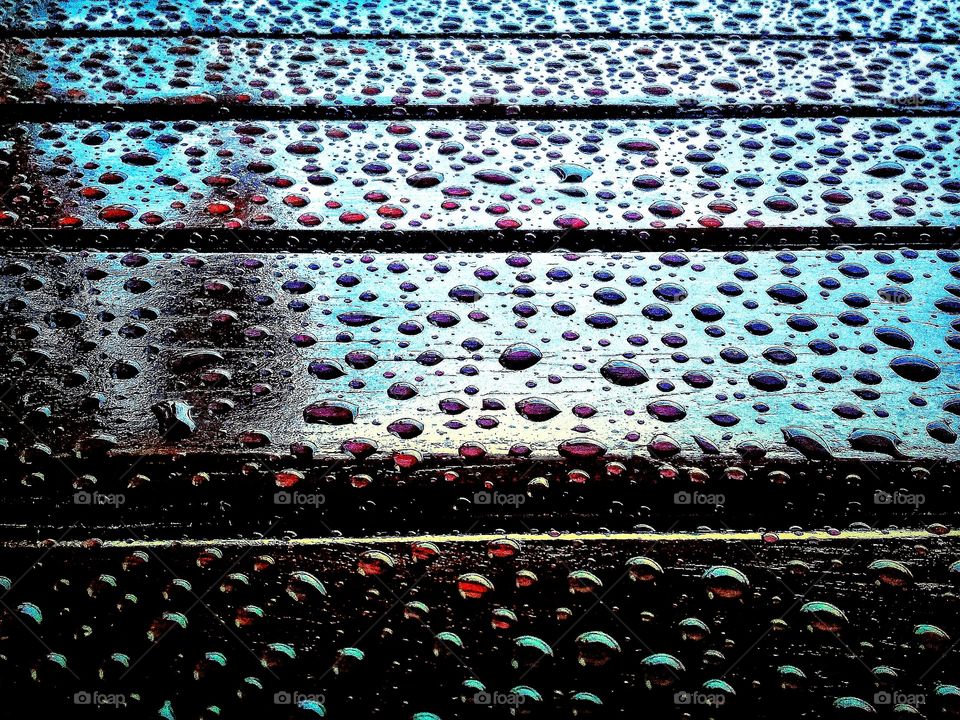 Rain drops on the table in the morning.