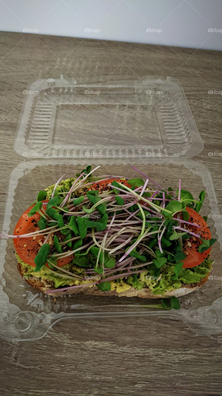 avacodo toast with tomatoes and leafy greens