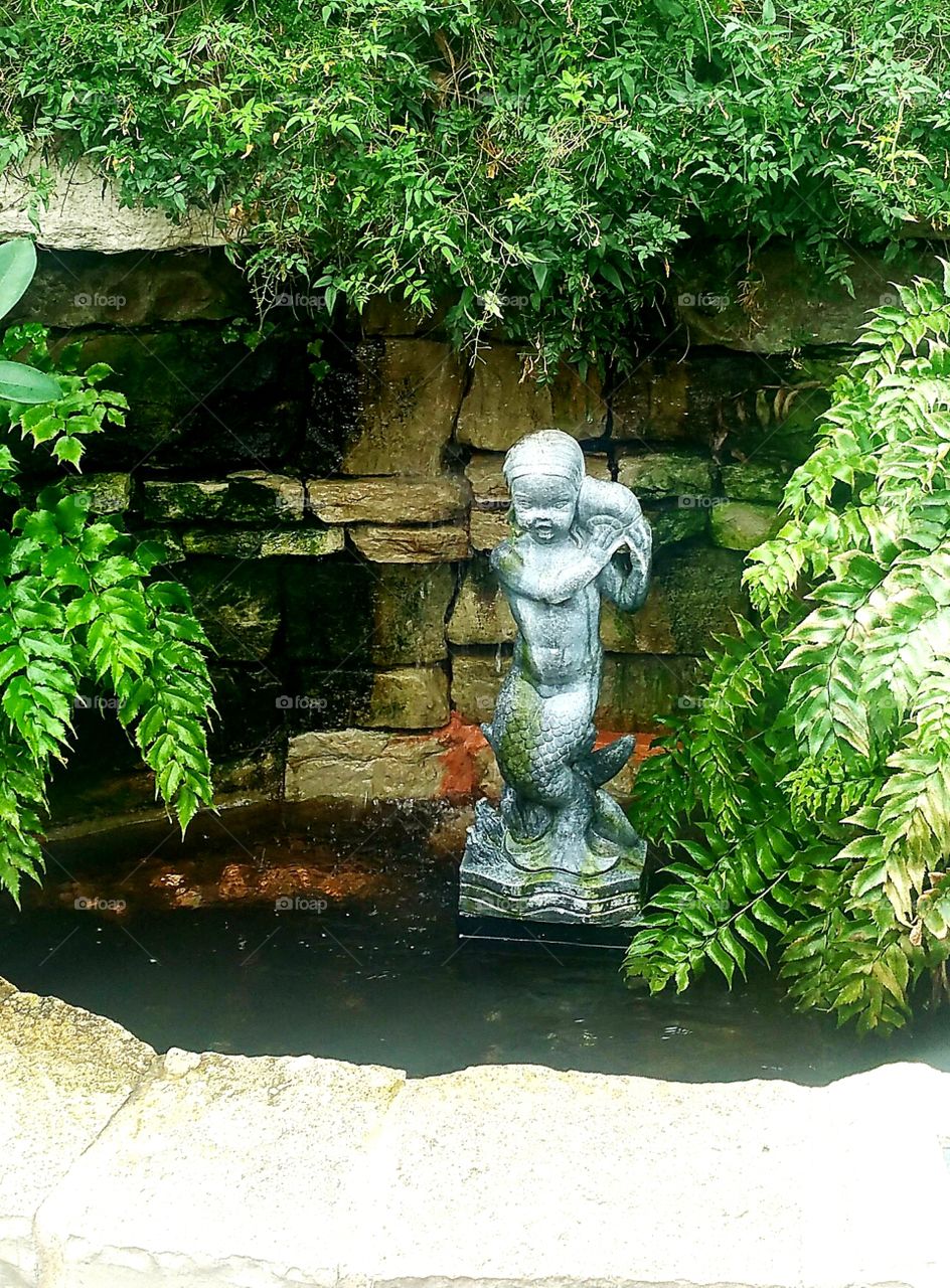 statue in pool
