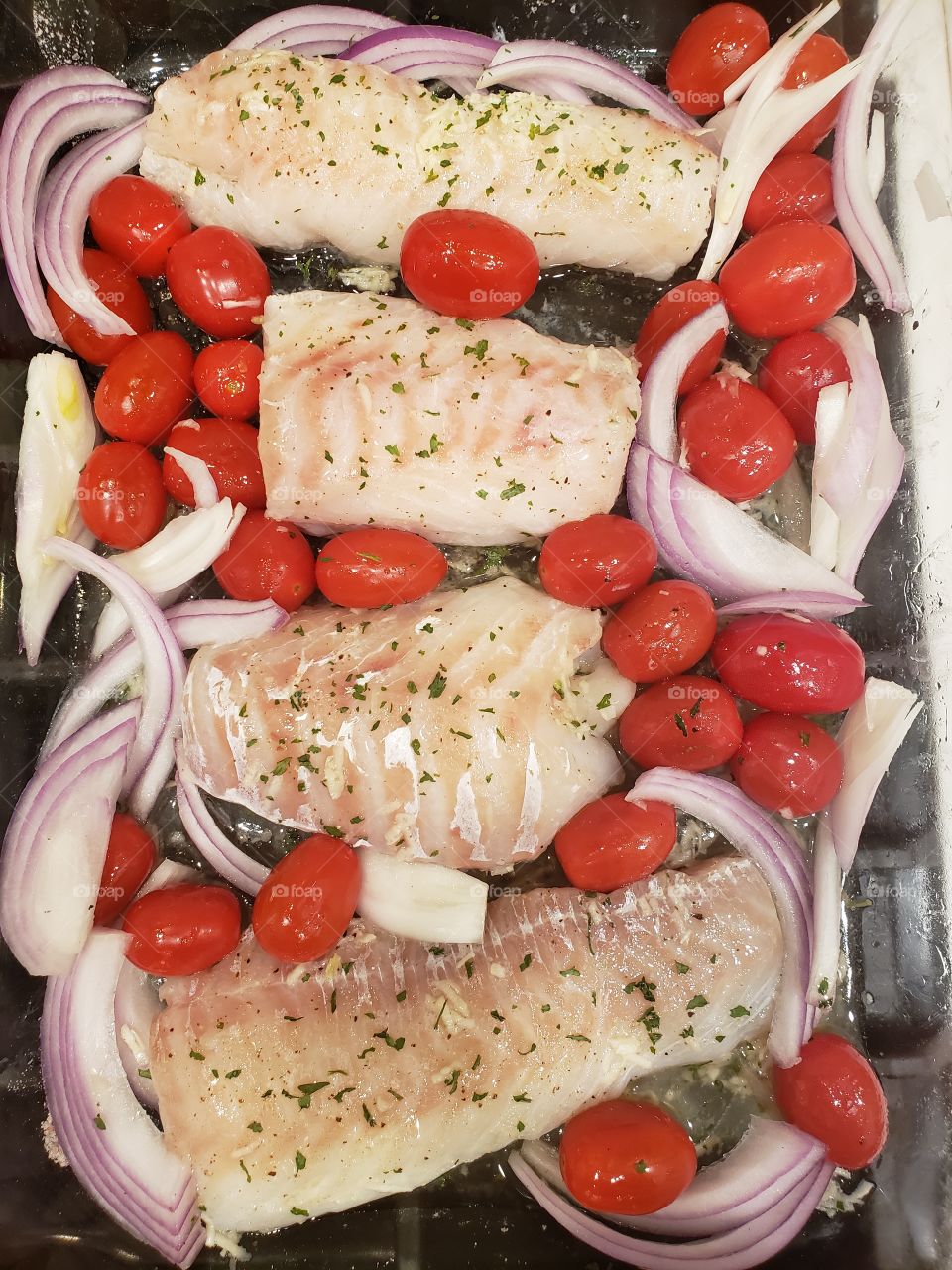 Fish with tomatoes and onions