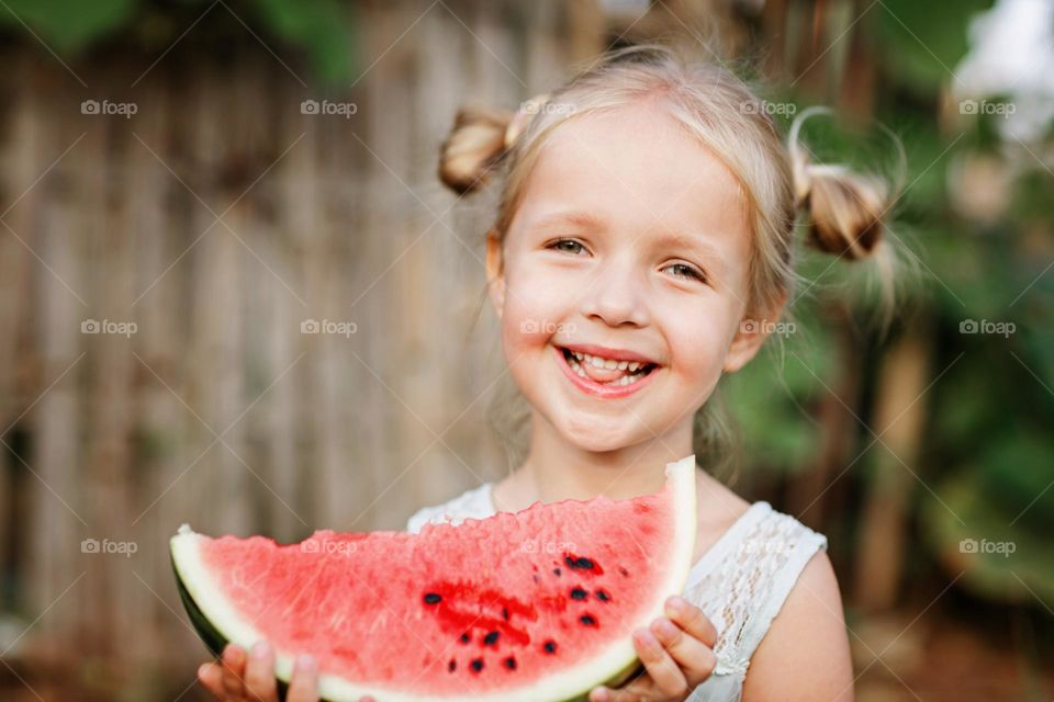 Little Caucasian girl feeling happiness outdoor 