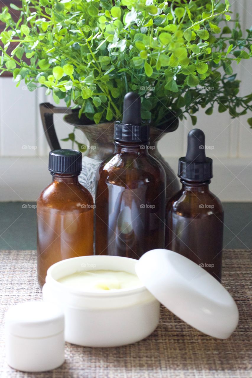 Homemade skin care products in at-home and purse-size containers