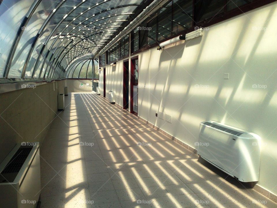 hallway with stained glass ceiling with nice lighting effects