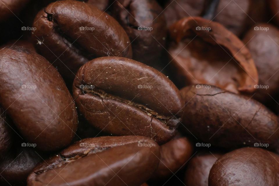 A bunch of roasted coffee beans