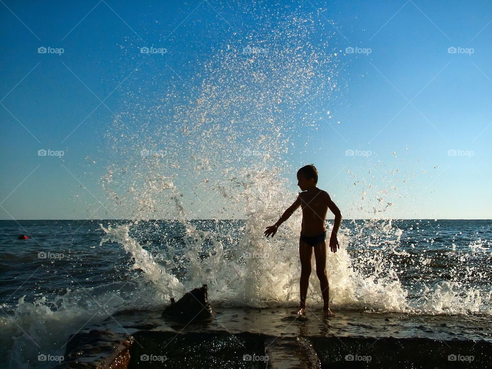 children and waves