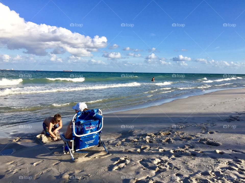 Mother and son enjoying the beach, Fort Lauderdale Beach, Florida