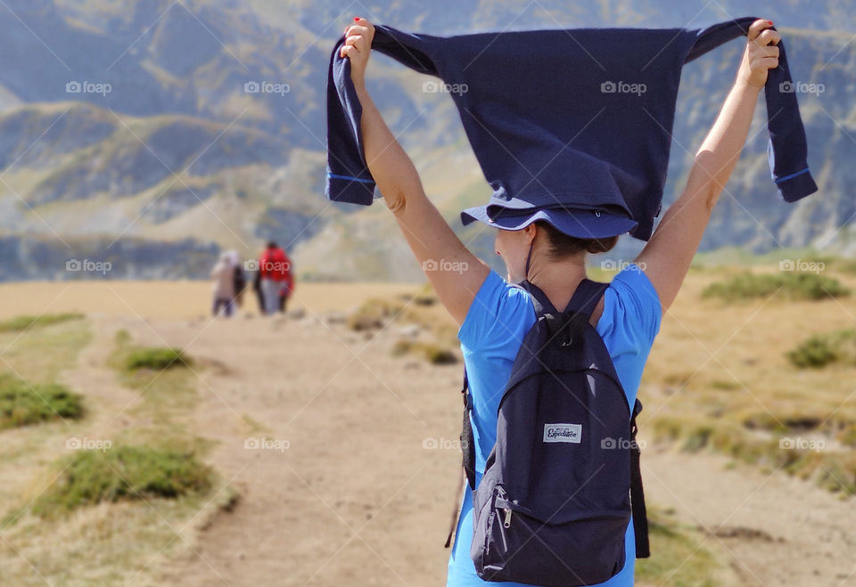 Hands up for summer hiking in the mountains