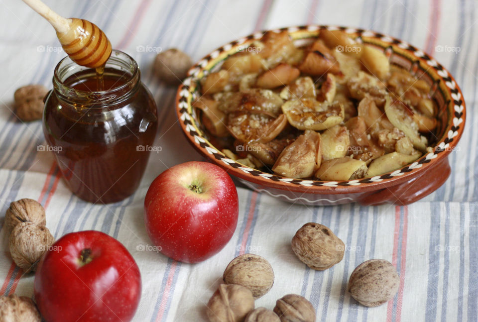 Rustic still life, baked apples with honey and walnuts, slow life in my countryside home