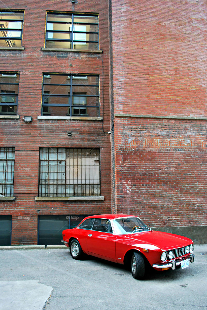 Vintage Red Car, Parked Outside Brick Building