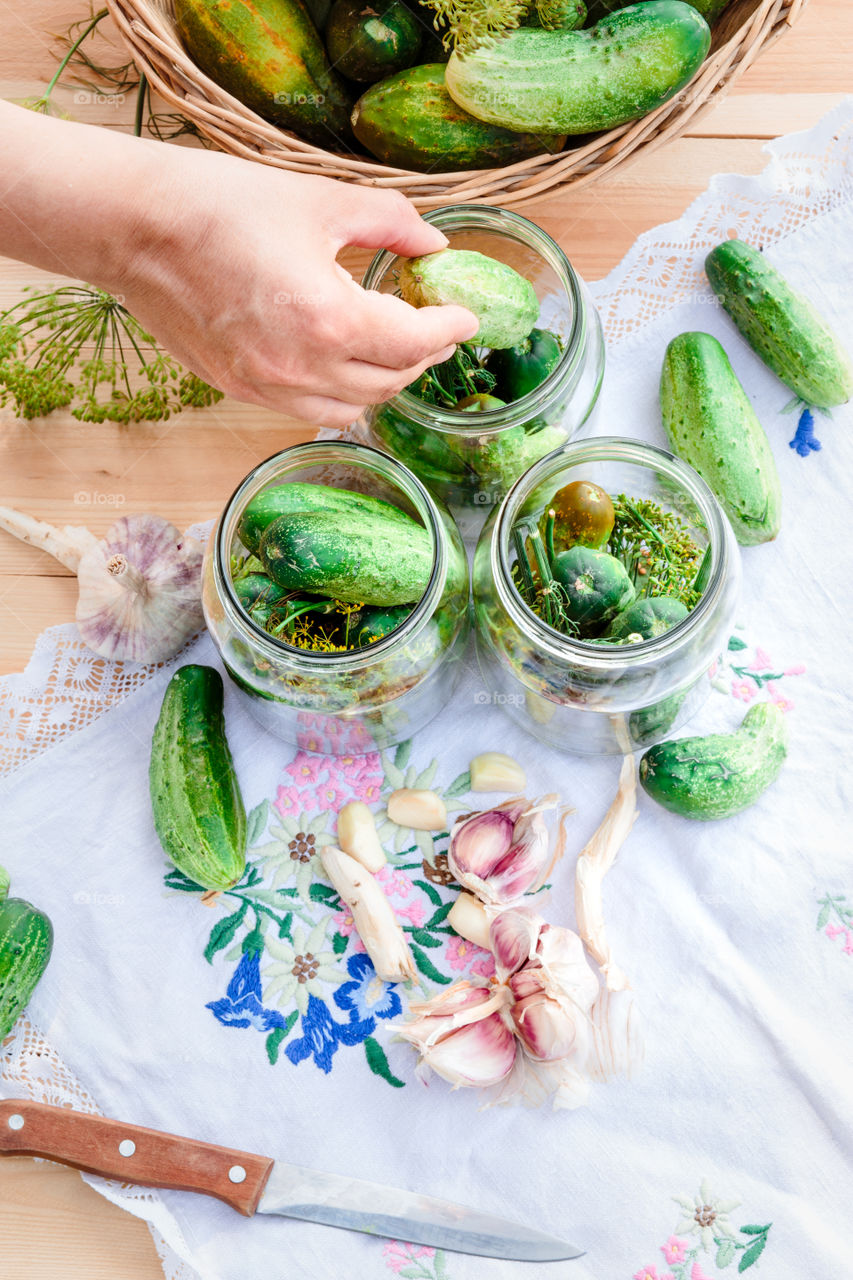 Pickling cucumbers. Pickling cucumbers with home garden vegetables and herbs