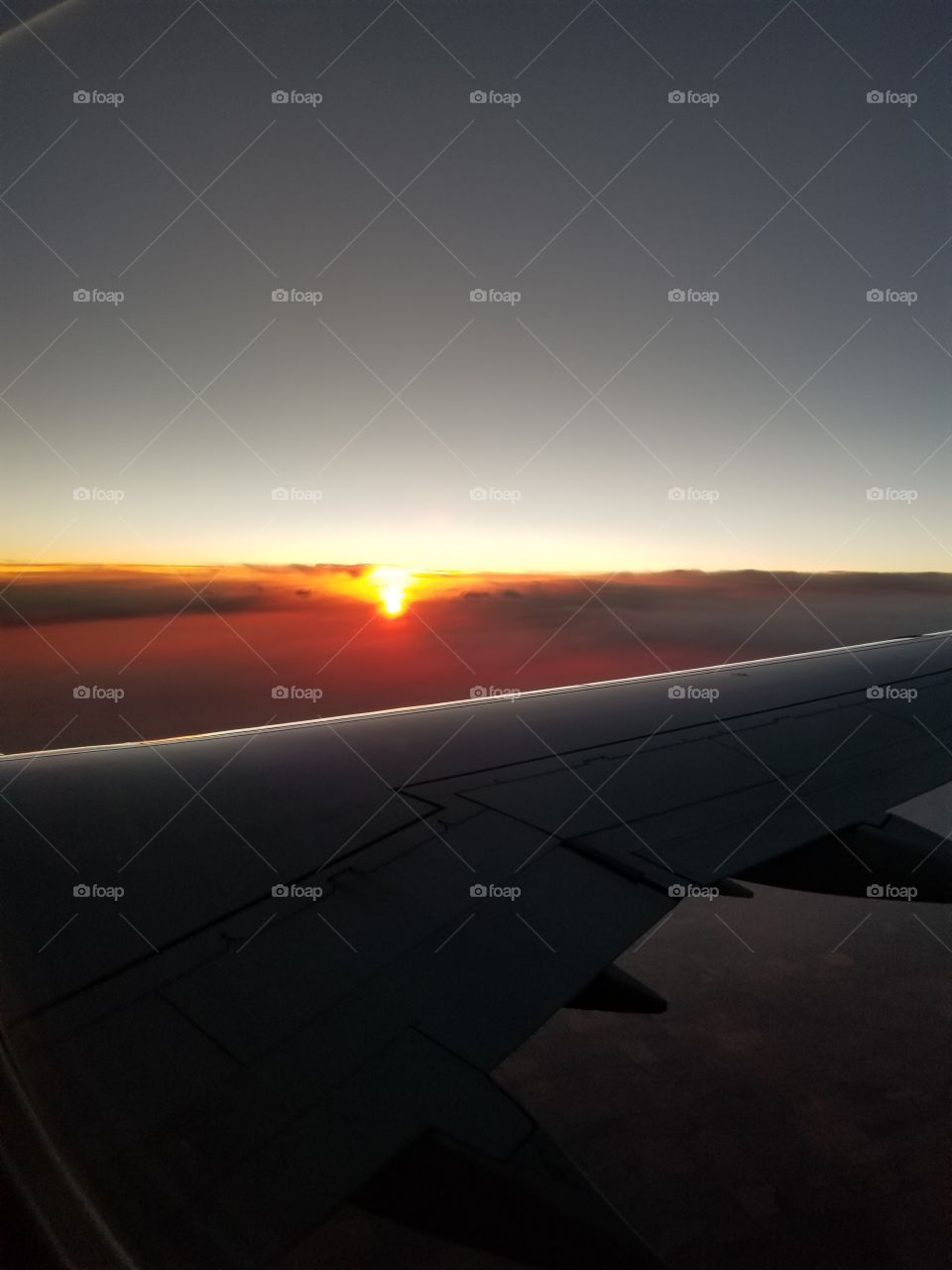 Sunset over plane wing 1