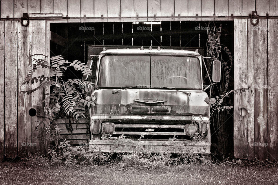 Old truck black and white in barn